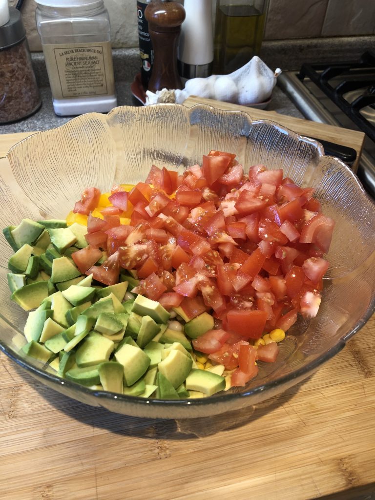Adding Avocado and tomatoes to the mix