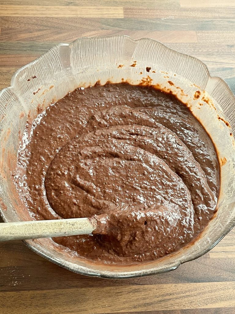 Adding the chocolate pieces to the cake batter