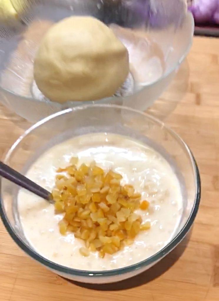 Adding the candied fruit to the filling