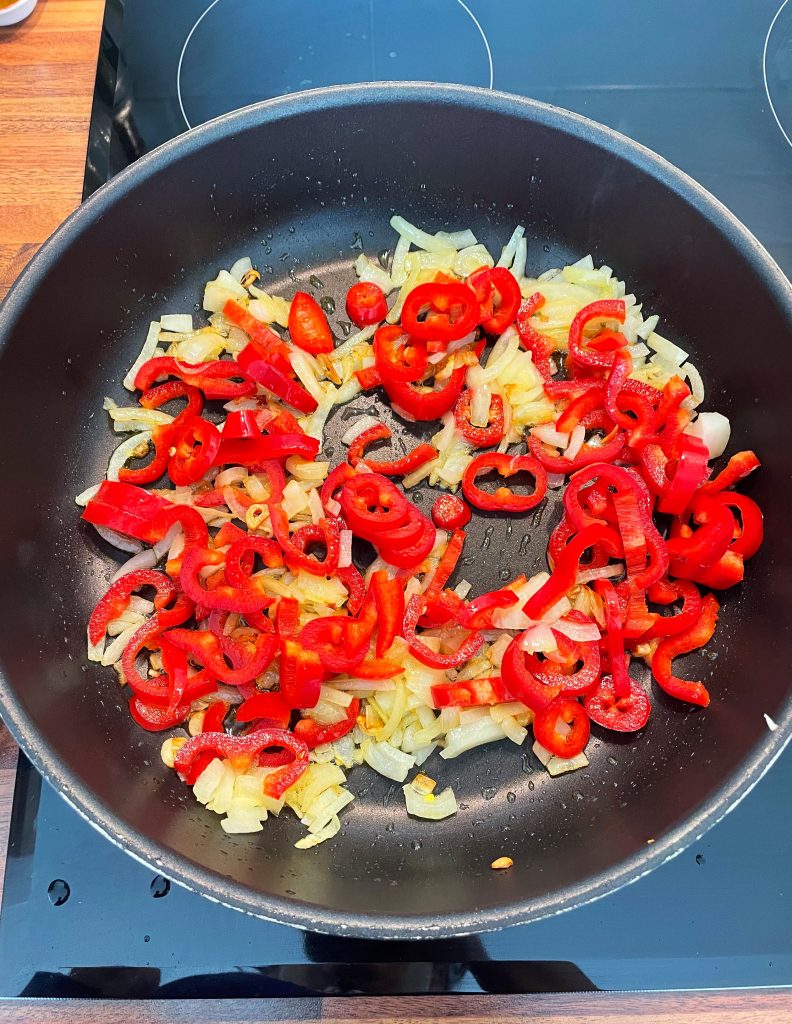 Add the sliced peppers